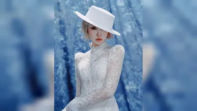 Kong Min-ji warms up for comeback wearing an all-white see-through dress
