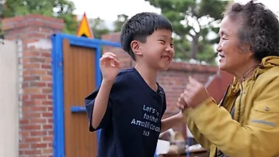 Grandmother in Gangjin balances nursing elderly relatives and raising grandson