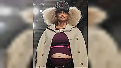 Ciara appears on Paris Fashion Week runway, revealing her heavily pregnant belly